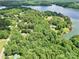 Beautiful aerial view showcasing the lake community with lush green surroundings and the serene lake at 4585 Sunrise Beach Rd, Catawba, NC 28609