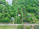 Beautiful aerial view of 4585 Sunrise Beach Rd property surrounded by lush trees near a quiet road in nature at 4585 Sunrise Beach Rd, Catawba, NC 28609
