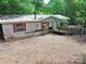 Exterior of a house with red shutters, offering a glimpse of the property's structure and condition at 4585 Sunrise Beach Rd, Catawba, NC 28609