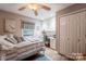 Neutral bedroom with hardwood floors, closet, built-in desk, and comfortable furnishings at 4805 Nesbitt Rd, Monroe, NC 28112