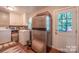 Functional laundry area featuring a washer, dryer, and access to the outside at 4805 Nesbitt Rd, Monroe, NC 28112