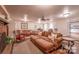 Large living room showcasing a brick fireplace, comfortable seating, and access to the kitchen and other rooms at 4805 Nesbitt Rd, Monroe, NC 28112