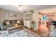 Comfortable living room with hardwood floors, plush sofa, and elegant decor, creating a cozy space at 4805 Nesbitt Rd, Monroe, NC 28112