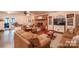 Inviting living room with a brick fireplace, hardwood floors, and comfortable furnishings at 4805 Nesbitt Rd, Monroe, NC 28112