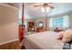 Serene main bedroom showcasing hardwood floors, classic furniture, and an abundance of natural light at 4805 Nesbitt Rd, Monroe, NC 28112