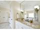 Bright bathroom featuring white vanity, marble countertop, large mirror, and access to a soaking tub and shower at 5827 Rileys Ridge Rd, Charlotte, NC 28226