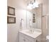 Bright bathroom featuring a vanity with a white countertop and decorative wall art at 5827 Rileys Ridge Rd, Charlotte, NC 28226