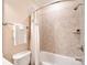 Bathroom with a tiled shower and tub combo, featuring a neutral color palette and simple fixtures at 5827 Rileys Ridge Rd, Charlotte, NC 28226