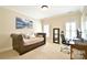 Bedroom offering a bed, an office space, neutral walls, and natural light from shuttered windows at 5827 Rileys Ridge Rd, Charlotte, NC 28226
