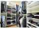 Spacious walk-in closet with custom shelving and hanging rods providing ample storage at 5827 Rileys Ridge Rd, Charlotte, NC 28226