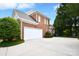 Spacious two-car garage and extended driveway provide ample parking at this brick-sided home at 5827 Rileys Ridge Rd, Charlotte, NC 28226