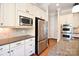 The kitchen has stainless steel appliances, granite countertops, and ample cabinet space at 5827 Rileys Ridge Rd, Charlotte, NC 28226