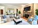 A comfortable living room with a stone fireplace is beautifully staged and decorated at 5827 Rileys Ridge Rd, Charlotte, NC 28226