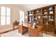Beautiful office featuring custom built-ins, an executive desk, and a large window for natural light at 5827 Rileys Ridge Rd, Charlotte, NC 28226