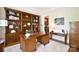 Elegant office is equipped with custom built-ins, a cozy desk, and ample storage at 5827 Rileys Ridge Rd, Charlotte, NC 28226