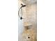 Close-up of an elegant walk-in shower with a rainfall showerhead and a built-in corner seat at 5827 Rileys Ridge Rd, Charlotte, NC 28226