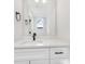 Sleek bathroom featuring a modern vanity with a black faucet, a large mirror, and contemporary fixtures at 622 Old Salisbury Rd, Statesville, NC 28677