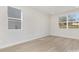 Bright bedroom with large windows, light wood floors, and ample space for personalization at 622 Old Salisbury Rd, Statesville, NC 28677