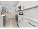 Stylish kitchen with white cabinetry, stainless steel appliances, and a bright window offering natural light at 622 Old Salisbury Rd, Statesville, NC 28677