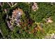 Aerial view showcasing the properties at 6616 and 6610 Sharon Hills Rd surrounded by mature trees and landscape at 6510 Sharon Hills Rd, Charlotte, NC 28210