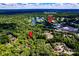 Scenic aerial view highlighting the property's location near Quail Hollow Club, golf course, and lush landscape at 6510 Sharon Hills Rd, Charlotte, NC 28210