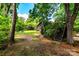 Charming backyard with stairs leading to yard of a wooded lot at 6510 Sharon Hills Rd, Charlotte, NC 28210