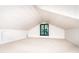 Attic bedroom with white walls, carpet flooring, a black window, and a vaulted ceiling at 6510 Sharon Hills Rd, Charlotte, NC 28210
