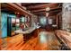 Rustic kitchen with stainless appliances, wood accents, wood flooring, and stone elements at 6510 Sharon Hills Rd, Charlotte, NC 28210