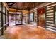 Screened porch featuring wood flooring, wood ceiling, and rustic door at 6510 Sharon Hills Rd, Charlotte, NC 28210