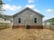Home exterior showing backyard, privacy fence, and professionally treated lawn at 652 Wilson St, Kannapolis, NC 28083