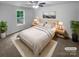A staged bedroom with natural light and ceiling fan at 652 Wilson St, Kannapolis, NC 28083