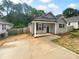 Inviting single-story home with a new concrete driveway, covered entry, and fresh landscaping at 652 Wilson St, Kannapolis, NC 28083