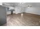 Spacious and bright open floor plan featuring wood-look flooring and neutral paint tones at 652 Wilson St, Kannapolis, NC 28083