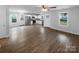Bright open concept with connecting kitchen featuring wood-look floors and neutral walls at 652 Wilson St, Kannapolis, NC 28083