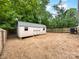 Backyard shot featuring a shed with a metal roof and a privacy fence at 652 Wilson St, Kannapolis, NC 28083