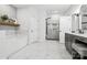 Bright bathroom with a standalone tub, glass-enclosed shower, and gray vanity with marble-look flooring at 754 Culp Ferguson Rd, Lancaster, SC 29720