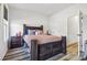 Cozy bedroom with a rustic wooden bed frame, matching nightstands, and warm, inviting lighting at 754 Culp Ferguson Rd, Lancaster, SC 29720