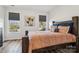 Inviting bedroom features a wooden bed frame, soft bedding, and large windows with a peaceful outdoor view at 754 Culp Ferguson Rd, Lancaster, SC 29720