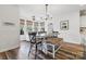 Bright dining room with modern decor, large windows, and a combination of bench and chair seating at 754 Culp Ferguson Rd, Lancaster, SC 29720
