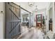 Spacious foyer showcasing modern wood flooring, sliding barn doors, and a welcoming entry with natural light at 754 Culp Ferguson Rd, Lancaster, SC 29720