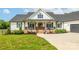 A charming home with a front porch, black shutters, and manicured landscaping offers great curb appeal at 754 Culp Ferguson Rd, Lancaster, SC 29720
