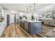 Spacious kitchen features an island with seating and stainless steel appliances, flowing into the living area at 754 Culp Ferguson Rd, Lancaster, SC 29720