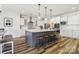 Bright kitchen boasts a large central island with seating, pendant lighting, and modern appliances at 754 Culp Ferguson Rd, Lancaster, SC 29720