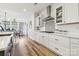 Well-lit kitchen with white cabinetry, granite countertops, stainless steel appliances, and a cozy breakfast nook at 754 Culp Ferguson Rd, Lancaster, SC 29720