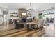 Inviting living room with stone fireplace, built-in shelving, recessed lighting, and access to the outdoor patio at 754 Culp Ferguson Rd, Lancaster, SC 29720