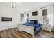 Serene main bedroom featuring stylish wood flooring, modern lighting, and a cozy electric fireplace at 754 Culp Ferguson Rd, Lancaster, SC 29720