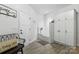 Bright mudroom features a dog shower with white subway tile, built-in cabinets, bench, and tile floors at 754 Culp Ferguson Rd, Lancaster, SC 29720