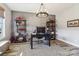Well-appointed home office with decorative shelving, modern lighting, and gray paneled accent wall at 754 Culp Ferguson Rd, Lancaster, SC 29720