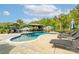 Inviting backyard pool surrounded by lounge chairs and shade structures offers a relaxing oasis at 754 Culp Ferguson Rd, Lancaster, SC 29720