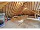 Unfinished attic features exposed wood beams and flooring offering potential for customization and additional storage at 8524 Quarters Ln, Mint Hill, NC 28227